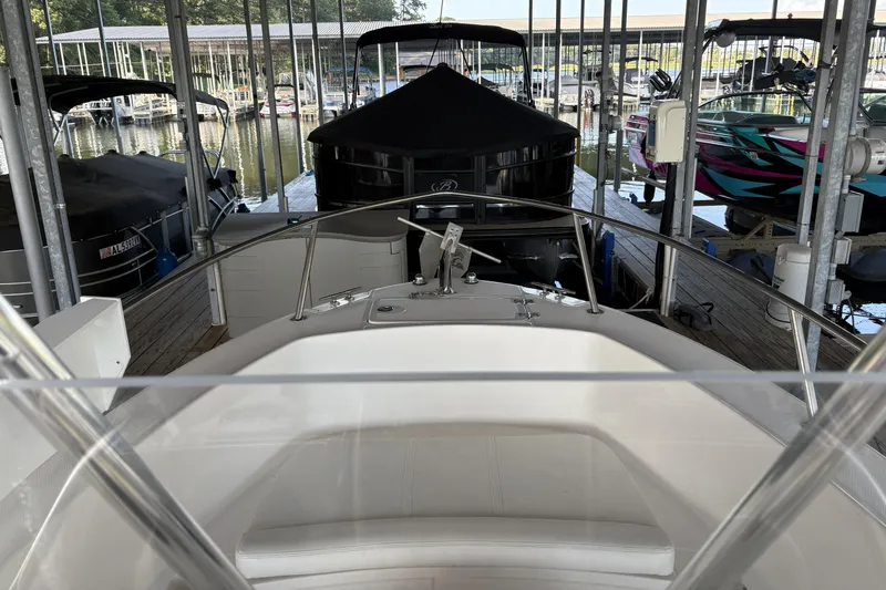 Slide: The Image of 2007 Edgewater 188CC boat docked in a marina, surrounded by other boats. - 14