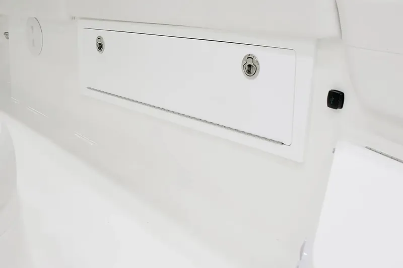 Slide: The Image of 2027 Regulator 30XO boat storage compartment with secure lock. - 10