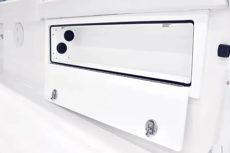 Slide: The Image of 2027 Regulator 30XO boat storage compartment with secure latches and sleek design. - 11