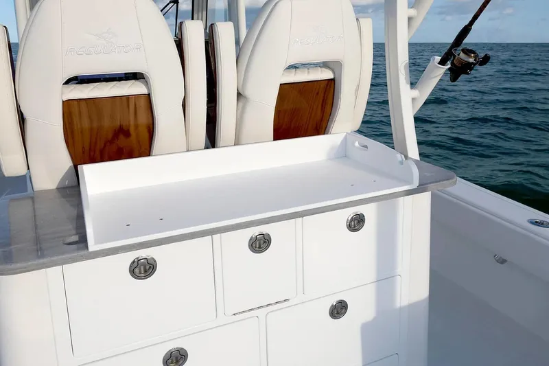 Slide: The Image of 2027 Regulator 30XO boat interior with fishing rod holder and storage compartments. - 14