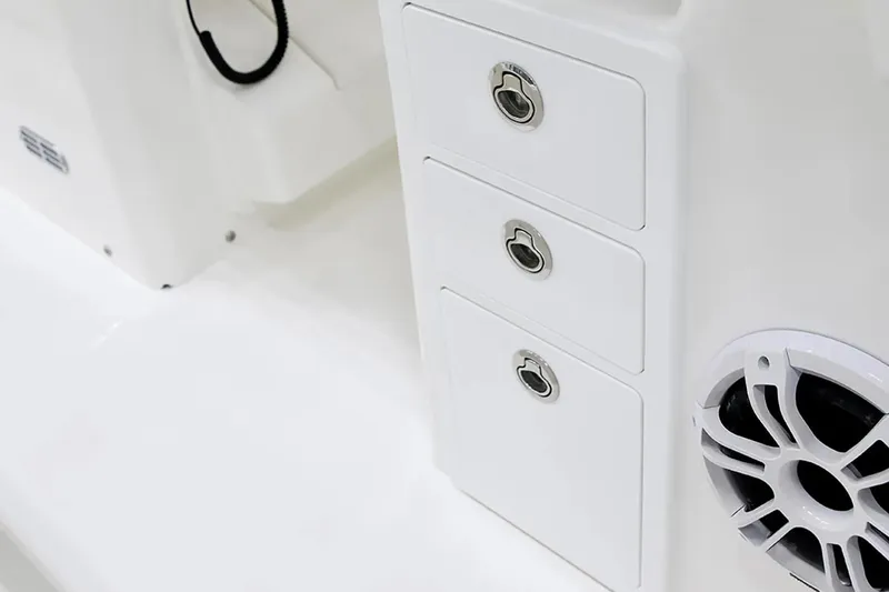 Slide: The Image of 2027 Regulator 30XO boat interior with storage compartments and speaker detail. - 17