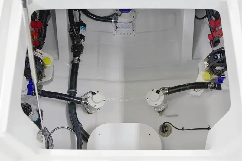 Slide: The Image of Interior view of 2027 Regulator 30XO boat's engine compartment with visible hoses and components. - 22