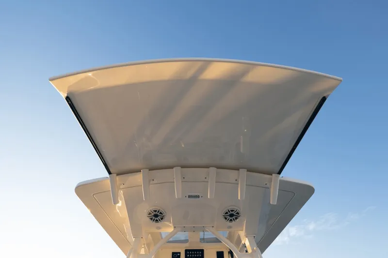 Slide: The Image of Scout 357 LXF 2027: Sleek design with modern speakers and mounts under a clear sky. - 44