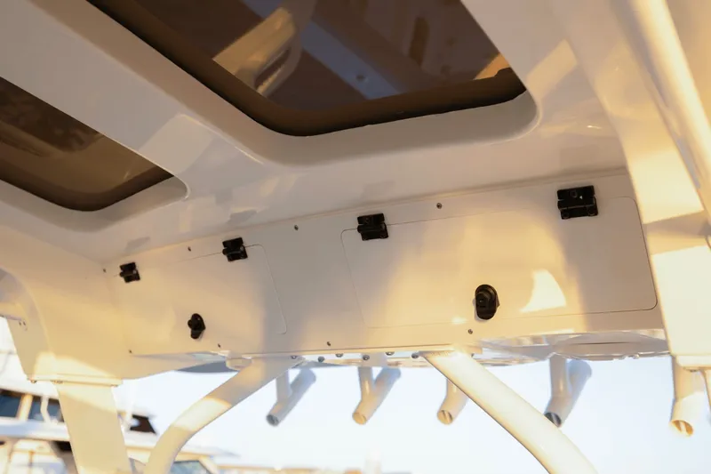 Slide: The Image of The image shows the roof of a Scout 357 LXF boat with multiple storage compartments. - 47