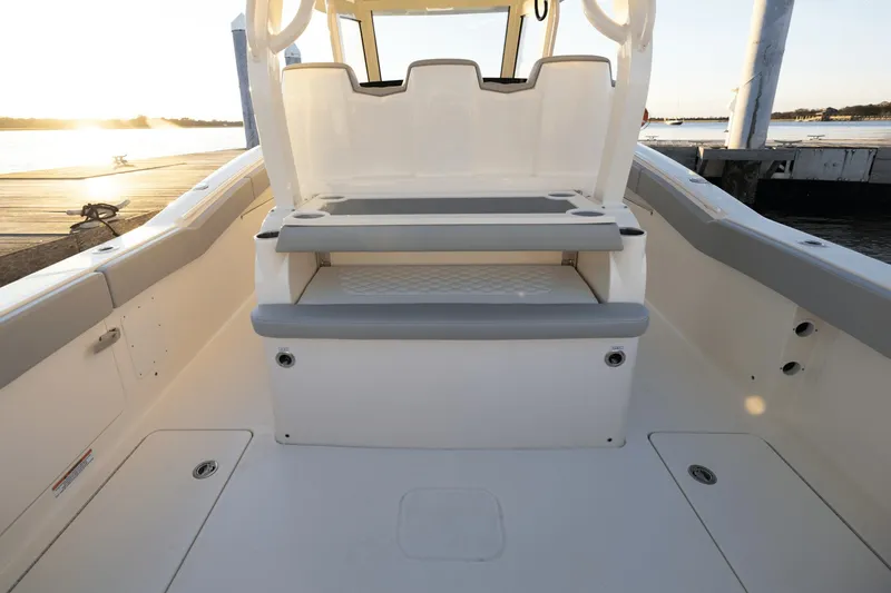 Slide: The Image of The image shows the cockpit of a Scout 357 LXF boat with gray upholstery. - 42