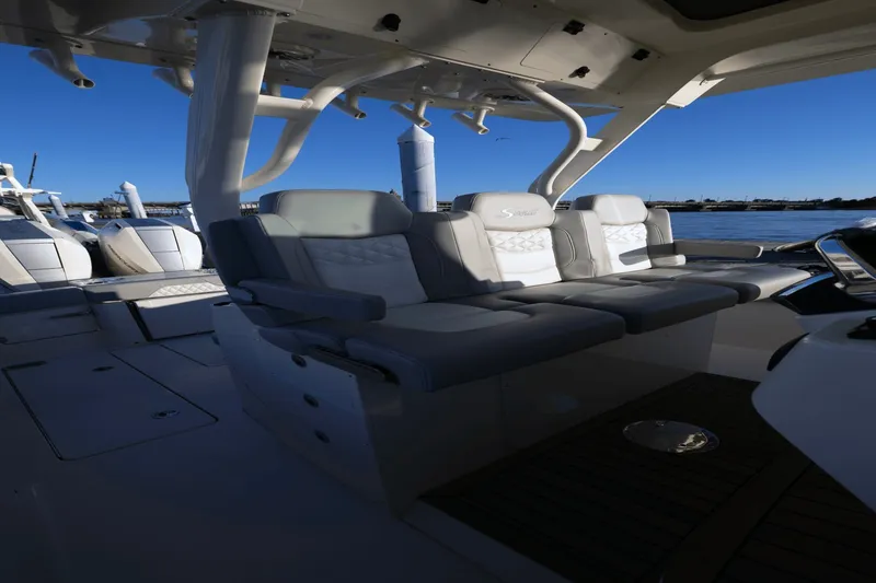 Slide: The Image of The 2027 Scout 357 LXF features luxurious cockpit seating overlooking the harbor. - 31