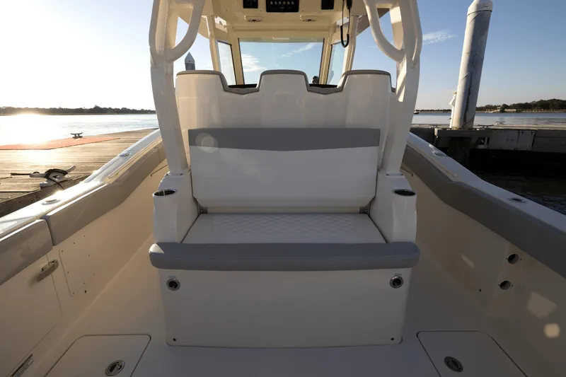 Slide: The Image of The image shows the cockpit of a Scout 357 LXF boat with sleek seating and a clear sky. - 21