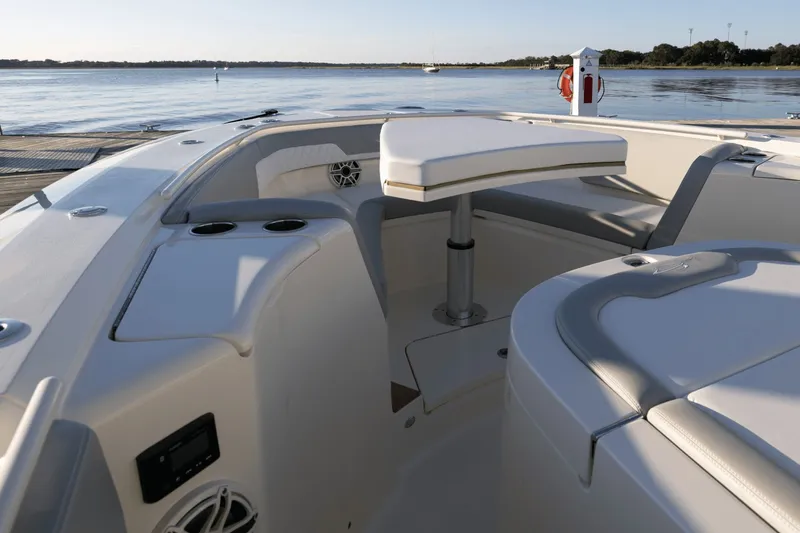 Slide: The Image of The image shows the cockpit of a 2027 Scout 357 LXF boat with sleek seating. - 12