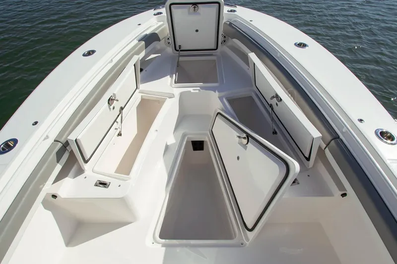 Slide: The Image of 2027 Regulator 25 boat with open storage compartments on deck, showcasing spacious design. - 5