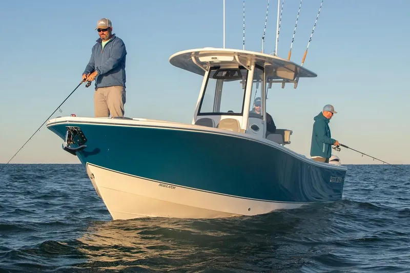Slide: The Image of 2027 Regulator 25 boat with anglers fishing on open water. - 8