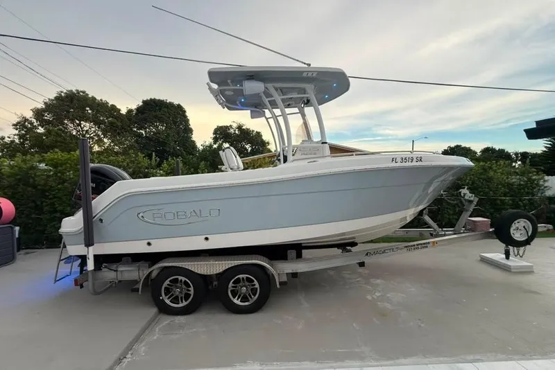 The Image of 2020 Robalo R222 Explorer boat on trailer, parked outdoors. - 0