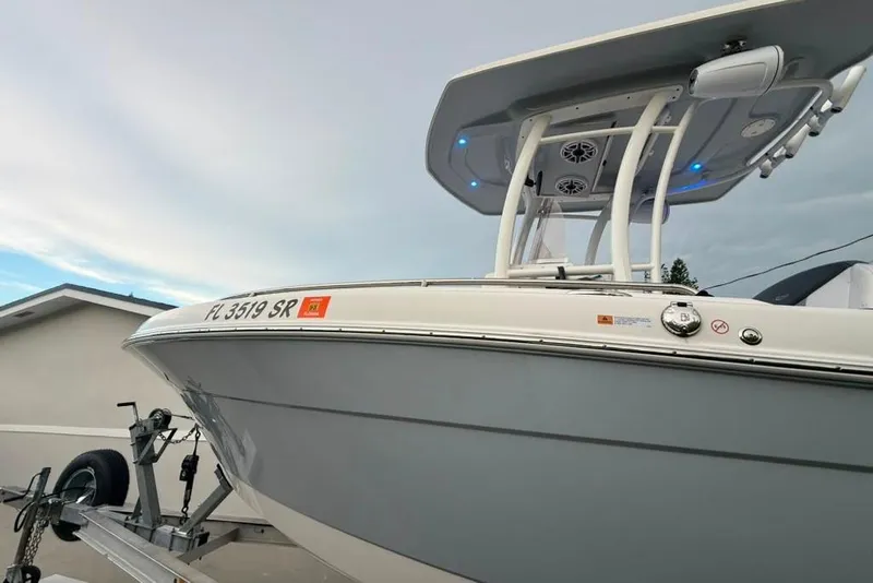 Slide: The Image of 2020 Robalo R222 Explorer boat on trailer, featuring sleek design and modern features. - 18