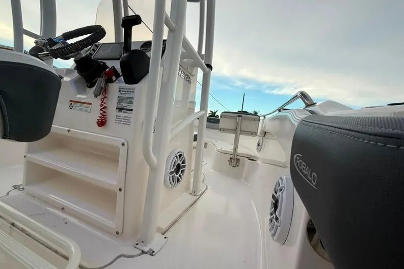 Slide: The Image of 2020 Robalo R222 Explorer boat interior with steering wheel and seating. - 19