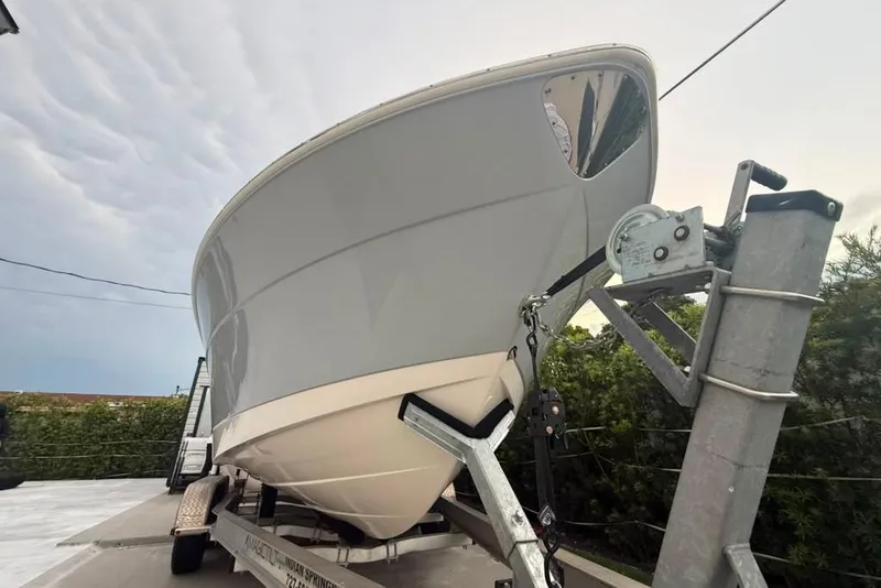 Slide: The Image of 2020 Robalo R222 Explorer boat on trailer, viewed from the front. - 21