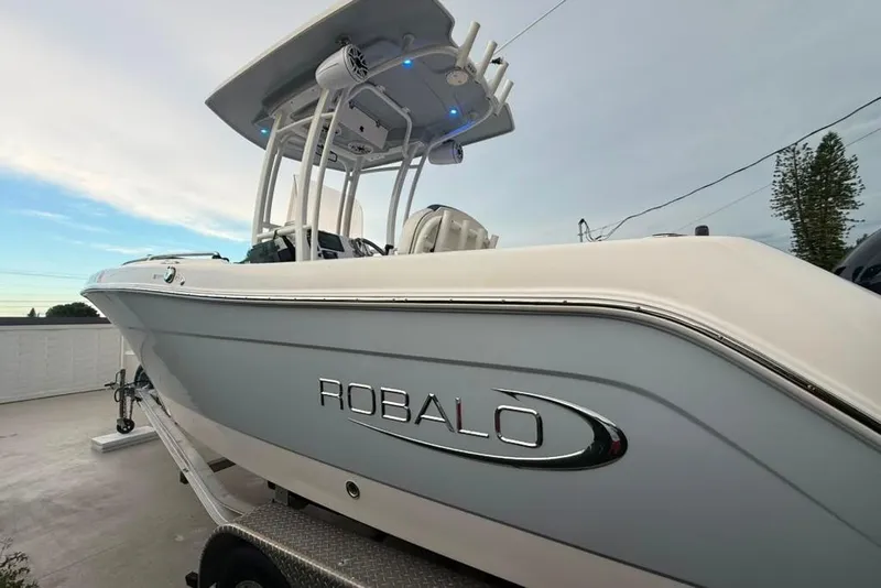 Slide: The Image of 2020 Robalo R222 Explorer boat on trailer, showcasing sleek design and modern features. - 23