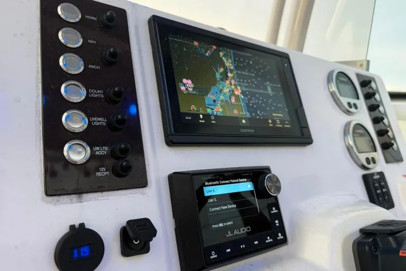 Slide: The Image of Control panel of 2020 Robalo R222 Explorer with Garmin navigation and JL Audio system. - 29