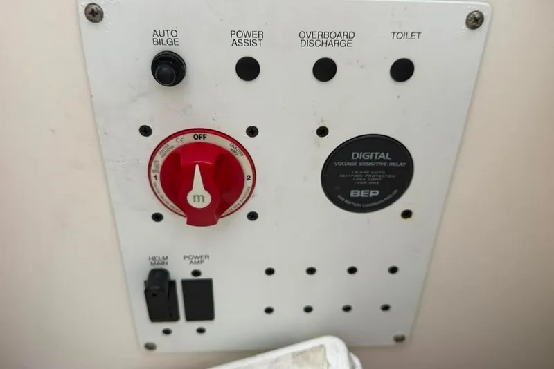 Slide: The Image of Control panel of a 2020 Robalo R222 Explorer boat with switches and voltage relay. - 40