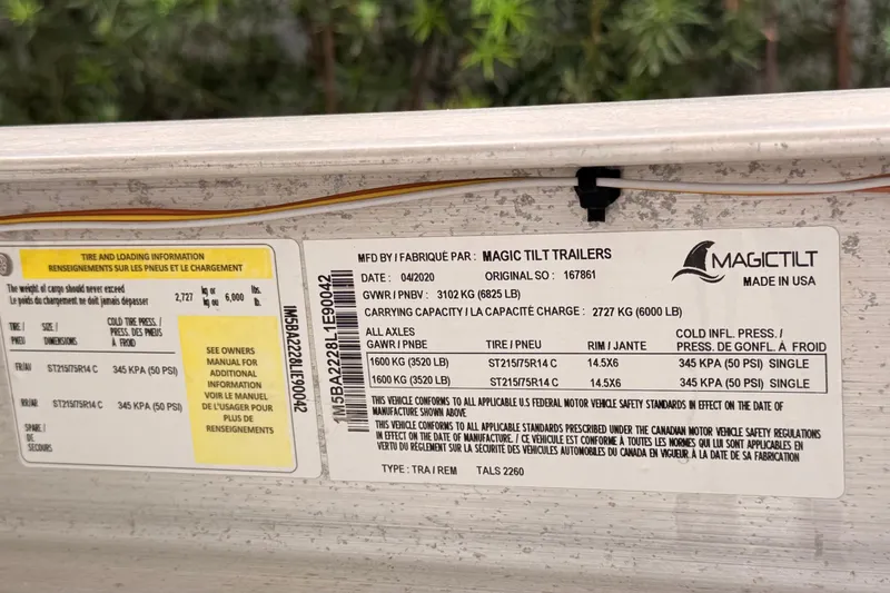 Slide: The Image of Label on Magic Tilt trailer with tire and loading information, dated April 2020. - 42