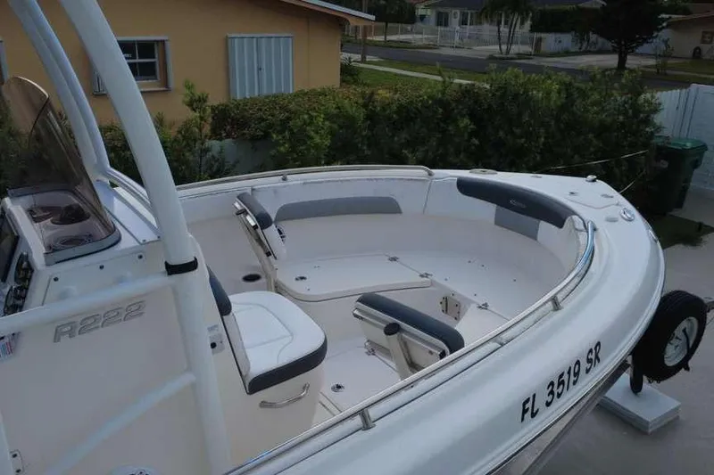 Slide: The Image of 2020 Robalo R222 Explorer boat with spacious seating and sleek design. - 5