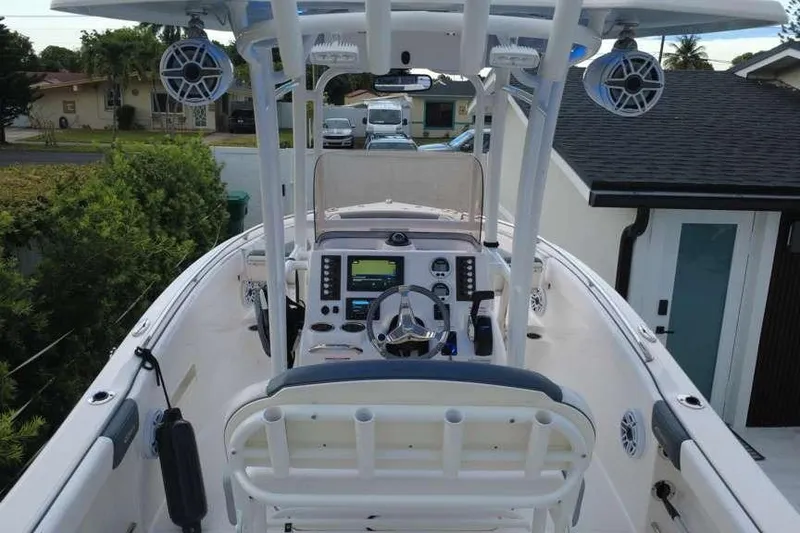 Slide: The Image of 2020 Robalo R222 Explorer boat cockpit with modern controls and speakers. - 6