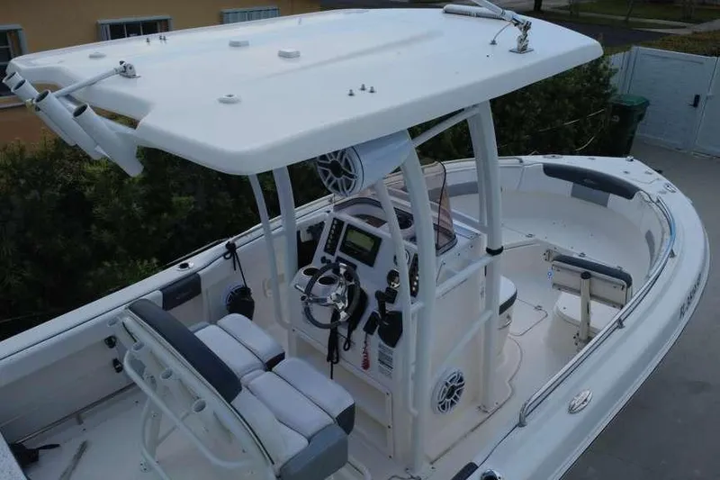 Slide: The Image of 2020 Robalo R222 Explorer boat with T-top and modern helm controls. - 7