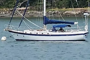 The Image of 1978 CSY 44 Center Cockpit sailboat anchored on calm water. - 0
