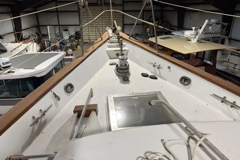 Slide: The Image of 1978 CSY 44 Center Cockpit sailboat deck in a storage facility. - 1