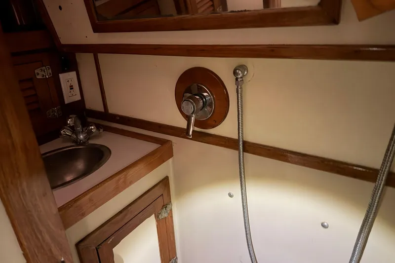 Slide: The Image of 1978 CSY 44 Center Cockpit bathroom with sink and shower fixtures. - 13
