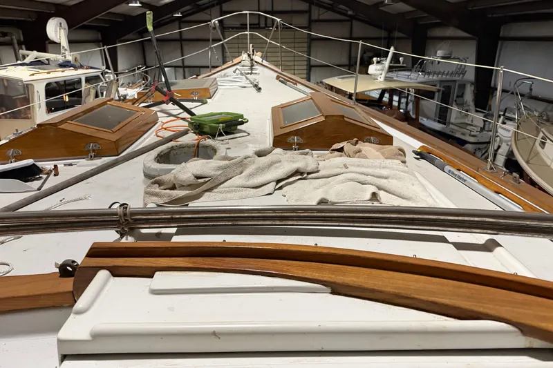 Slide: The Image of 1978 CSY 44 Center Cockpit sailboat deck with maintenance tools and cloths. - 15