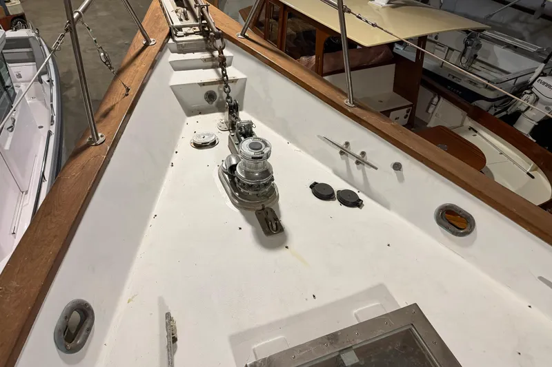 Slide: The Image of 1978 CSY 44 Center Cockpit sailboat deck with anchor chain and winch. - 2