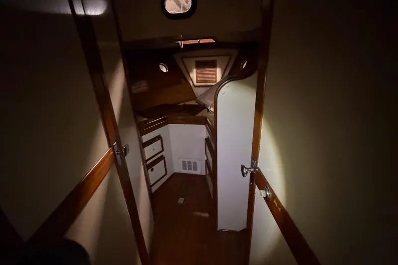 Slide: The Image of Dimly lit cabin interior of a 1978 CSY 44 Center Cockpit sailboat. - 21