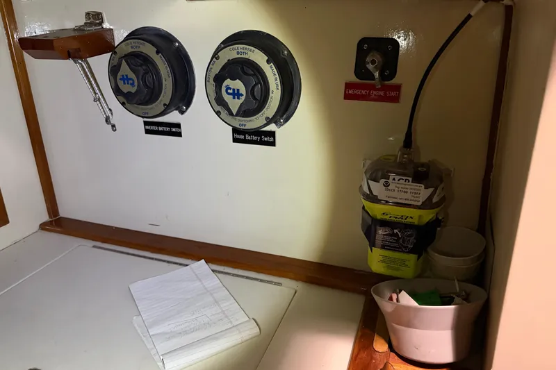 Slide: The Image of Electrical panel of a 1978 CSY 44 Center Cockpit sailboat with battery switches and emergency start. - 24