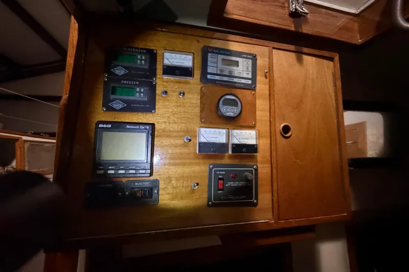Slide: The Image of Control panel of a 1978 CSY 44 Center Cockpit sailboat with various gauges and switches. - 27