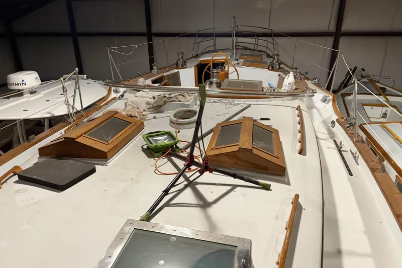 Slide: The Image of 1978 CSY 44 Center Cockpit sailboat deck with wooden hatches and equipment. - 3