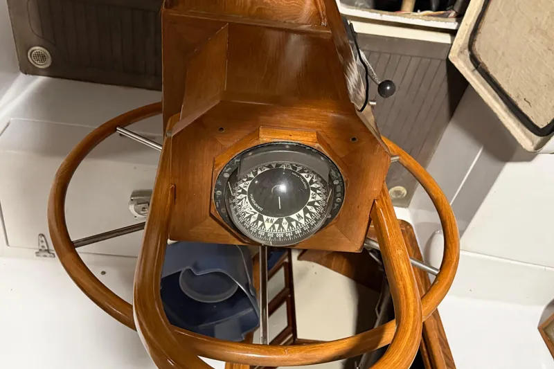 Slide: The Image of 1978 CSY 44 Center Cockpit helm with wooden wheel and compass. - 7