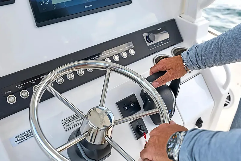 Slide: The Image of Steering console of a 2027 Regulator 23 boat with modern controls and display. - 10