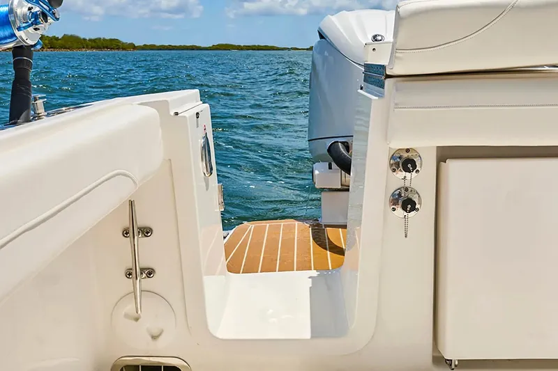 Slide: The Image of 2027 Regulator 23 boat interior with view of water and motor. - 2
