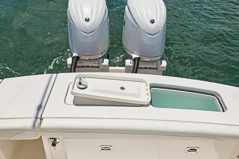 Slide: The Image of 2027 Regulator 23 boat with dual outboard motors on water. - 4