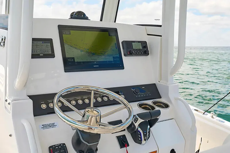 Slide: The Image of Helm of 2027 Regulator 23 boat with advanced navigation and control systems. - 9
