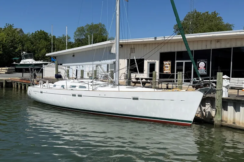 The Image of 2003 Beneteau Oceanis 473 sailboat docked at marina, clear day. - 0