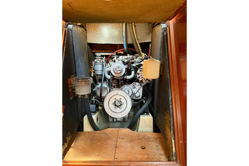 Slide: The Image of Engine compartment of a 2003 Beneteau Oceanis 473 sailboat, showcasing mechanical components. - 11