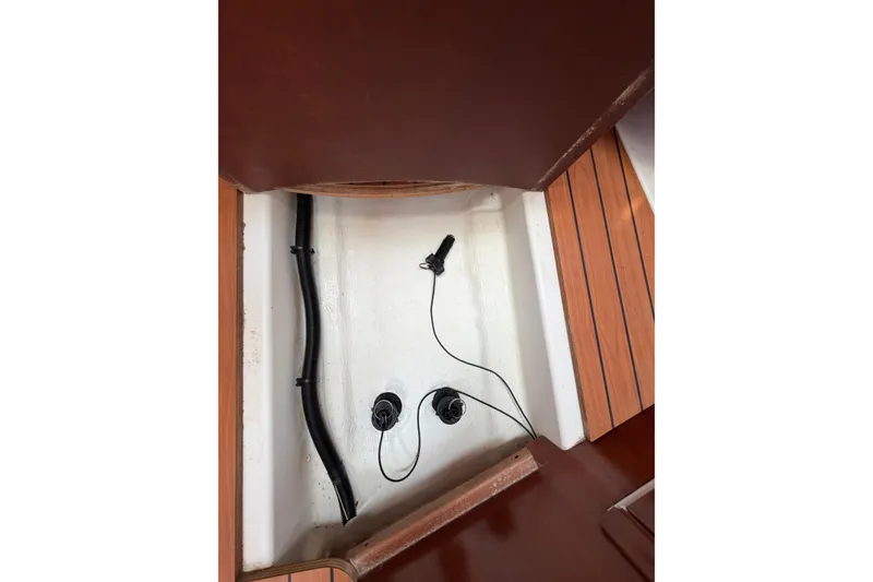 Slide: The Image of Bilge area of a 2003 Beneteau Oceanis 473 sailboat with visible wiring and tubing. - 21