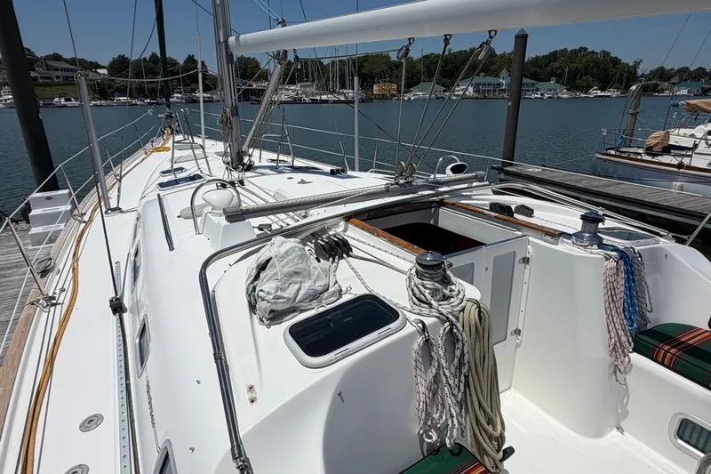 Slide: The Image of 2003 Beneteau Oceanis 473 sailboat docked, showcasing deck and rigging details. - 27