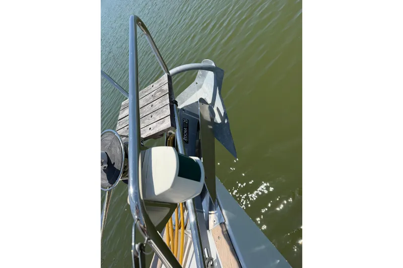Slide: The Image of Bow of 2003 Beneteau Oceanis 473 sailboat with anchor over calm water. - 31