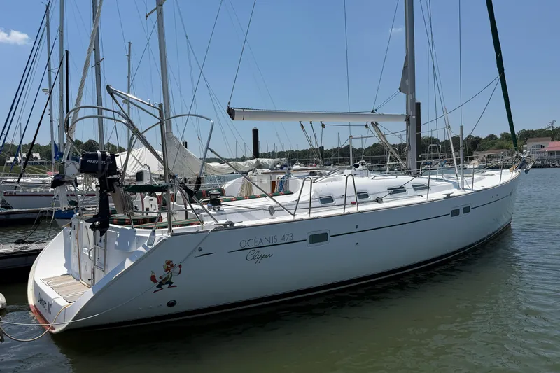 Slide: The Image of 2003 Beneteau Oceanis 473 sailboat docked at marina, sunny day, clear sky. - 35