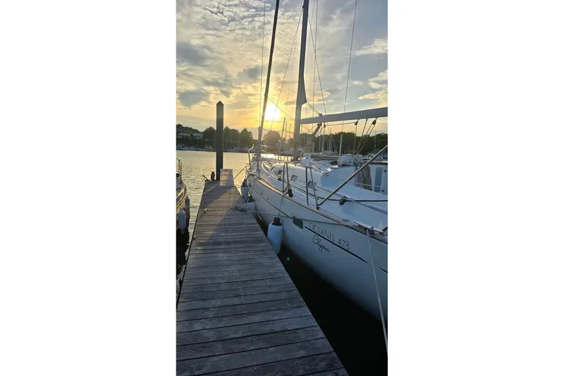 Slide: The Image of Beneteau Oceanis 473 sailboat docked at sunset, 2003 model. - 36