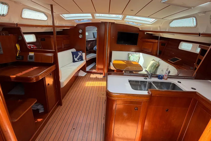Slide: The Image of Interior of 2003 Beneteau Oceanis 473 yacht with wood finish and modern amenities. - 5