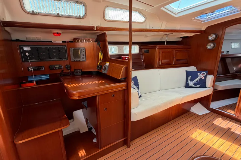Slide: The Image of Interior of 2003 Beneteau Oceanis 473 yacht with wooden finish and nautical decor. - 6