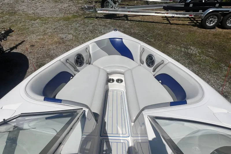 Slide: The Image of 2002 Moomba Mobius LSV boat interior with blue and white seating and speakers. - 11