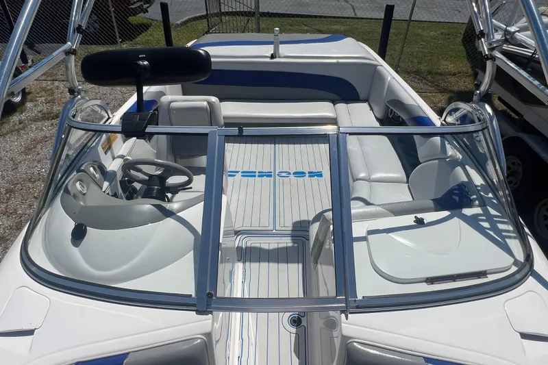 Slide: The Image of 2002 Moomba Mobius LSV boat interior with steering wheel and seating. - 12